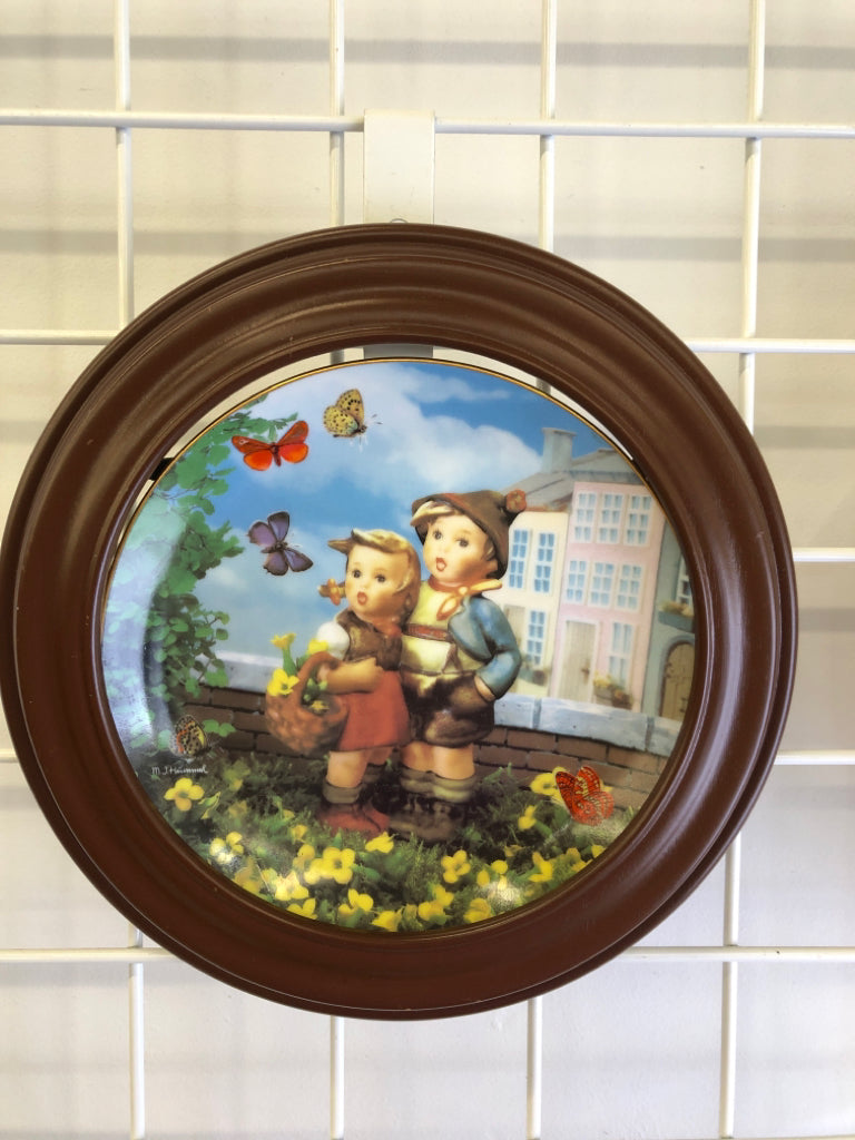 2 HUMMEL PLATES IN WOOD FRAME.