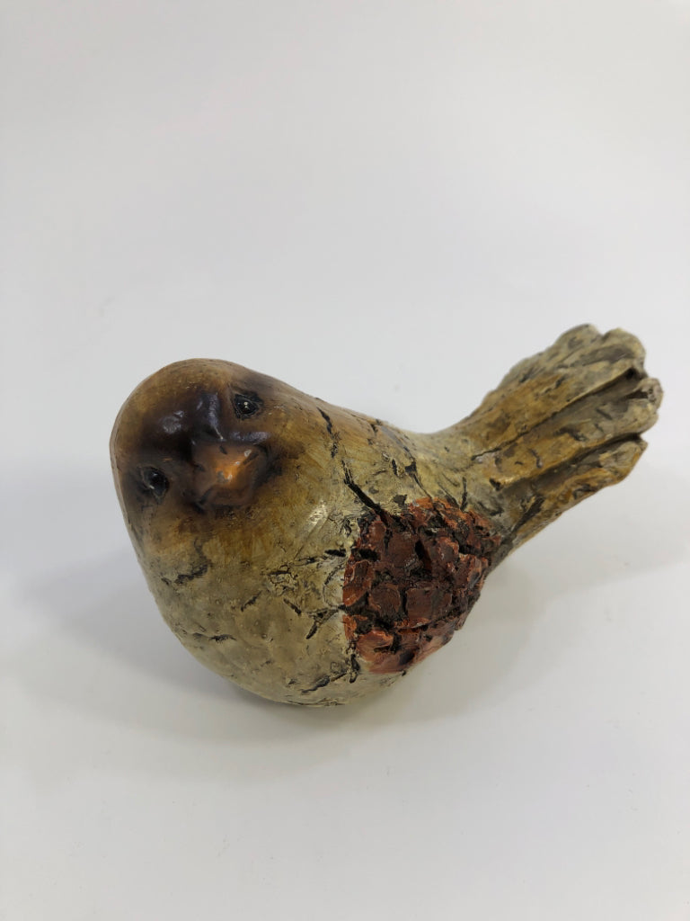 SMALL TEXTURED BROWN BIRD.