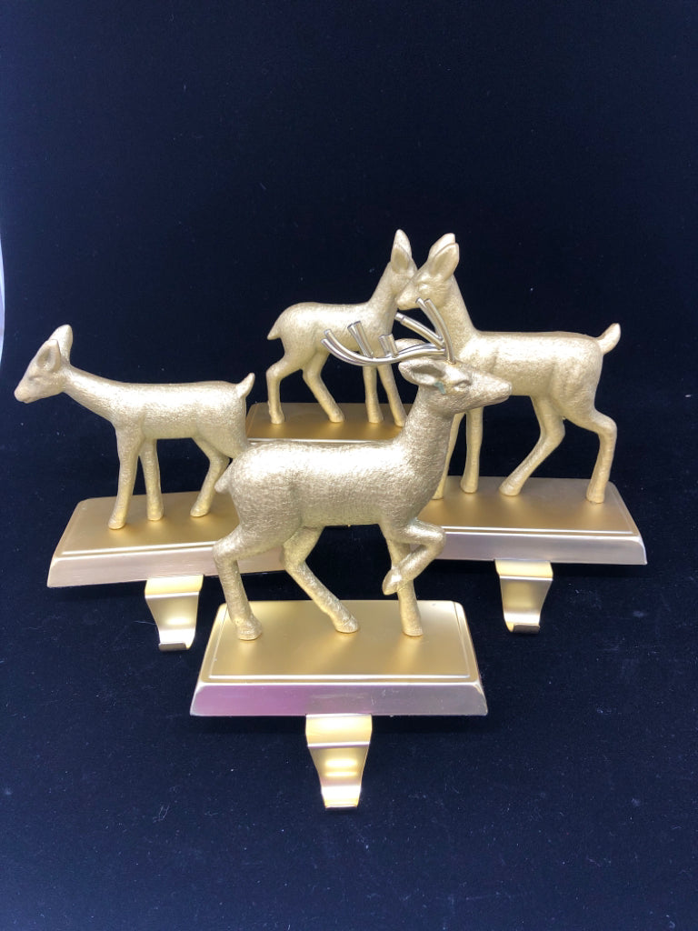 4 GOLD DEER STOCKING HOLDERS.