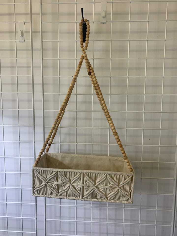 MACRAME HANGING BEADED BASKET.