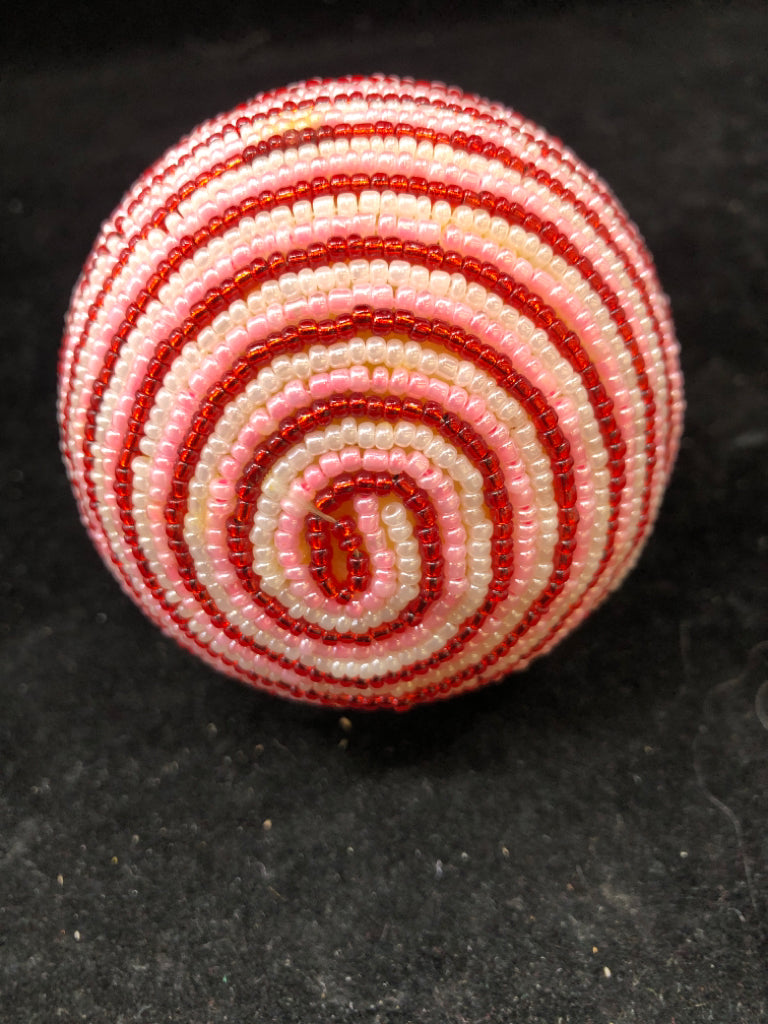 RED/PINK/WHITE STRIPE BEADED ORNAMENT.
