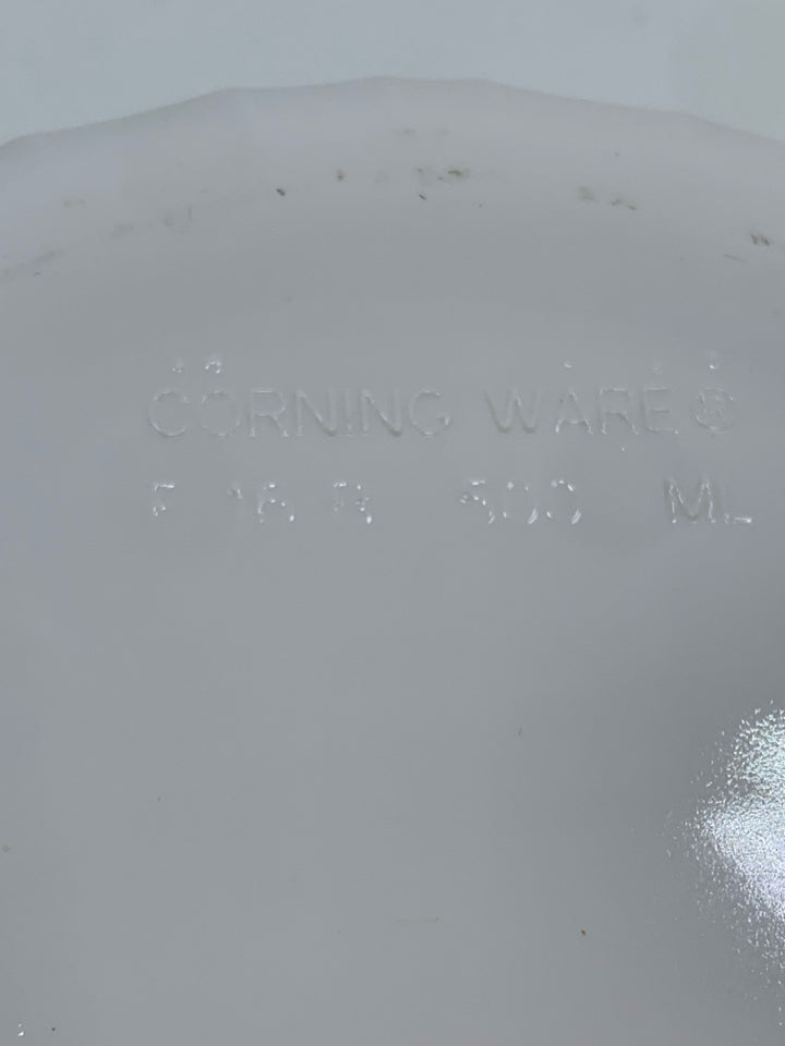 COVERED CORNING WARE DISH.