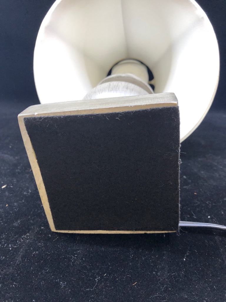 GREY WOOD BASE TABLE LAMP W/CREAM SHADE.