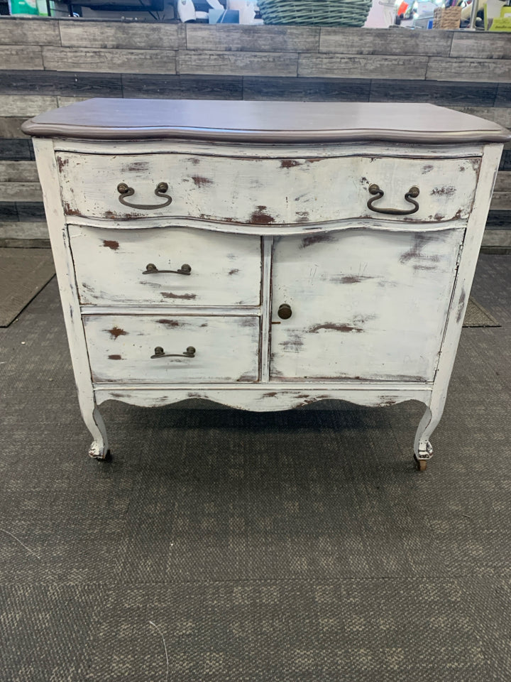 DISTRESSED DRESSER ON WHEELS.