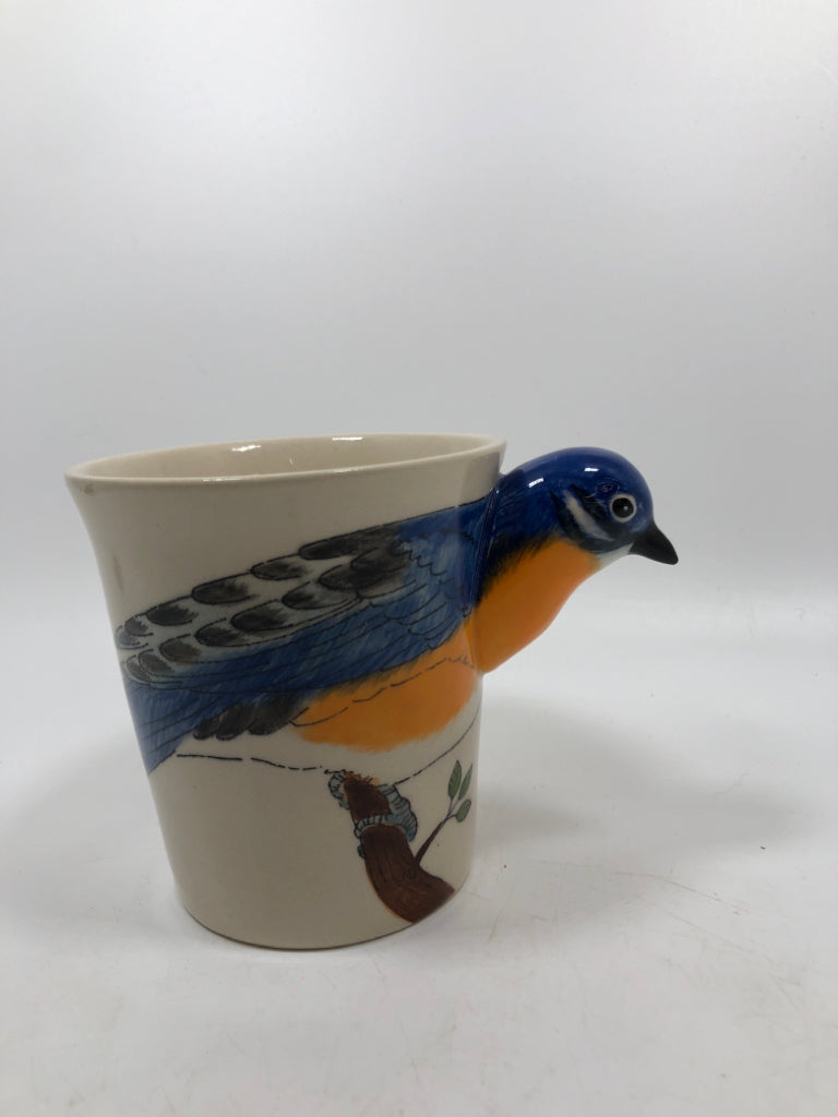 BLUE BIRD HANDLE STONEWARE MUG.