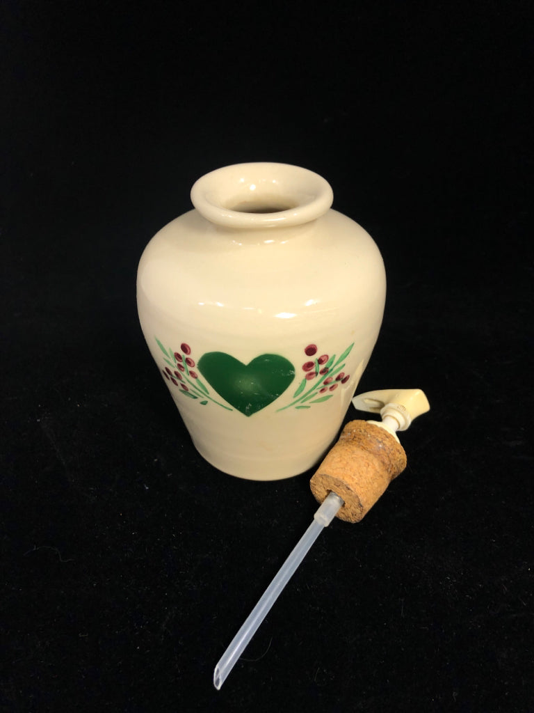 PRIMITIVE CREAM STONEWARE SOAP DISPENSER W/GREEN HEART.