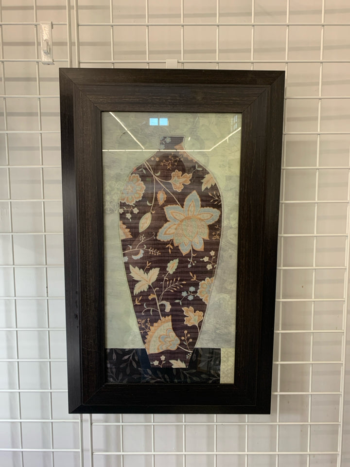 BROWN PAISLEY PATTERN VASE WALL HANGING IN BLACK FRAME.