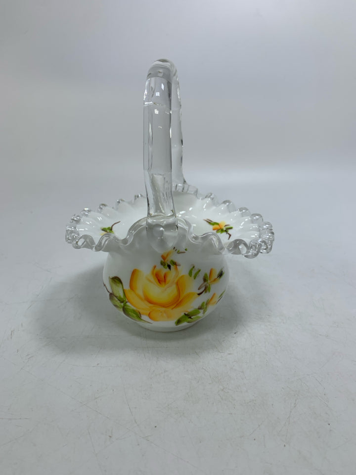 MILK GLASS BASKET W/ PAINTED YELLOW FLOWERS CLEAR HANDLE.