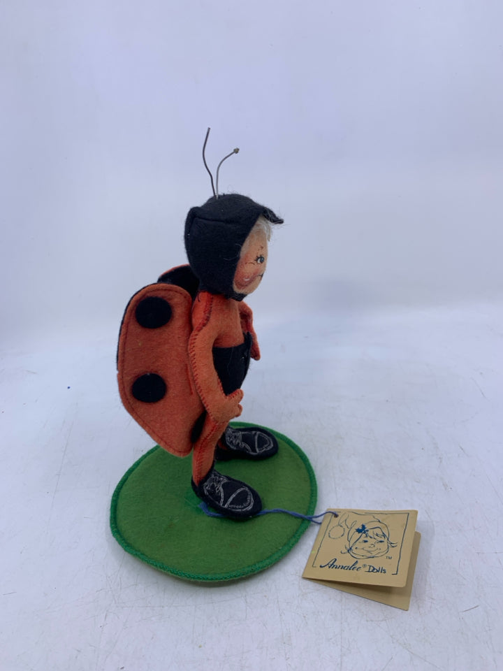 PERSON DRESSED AS LADY BUG.