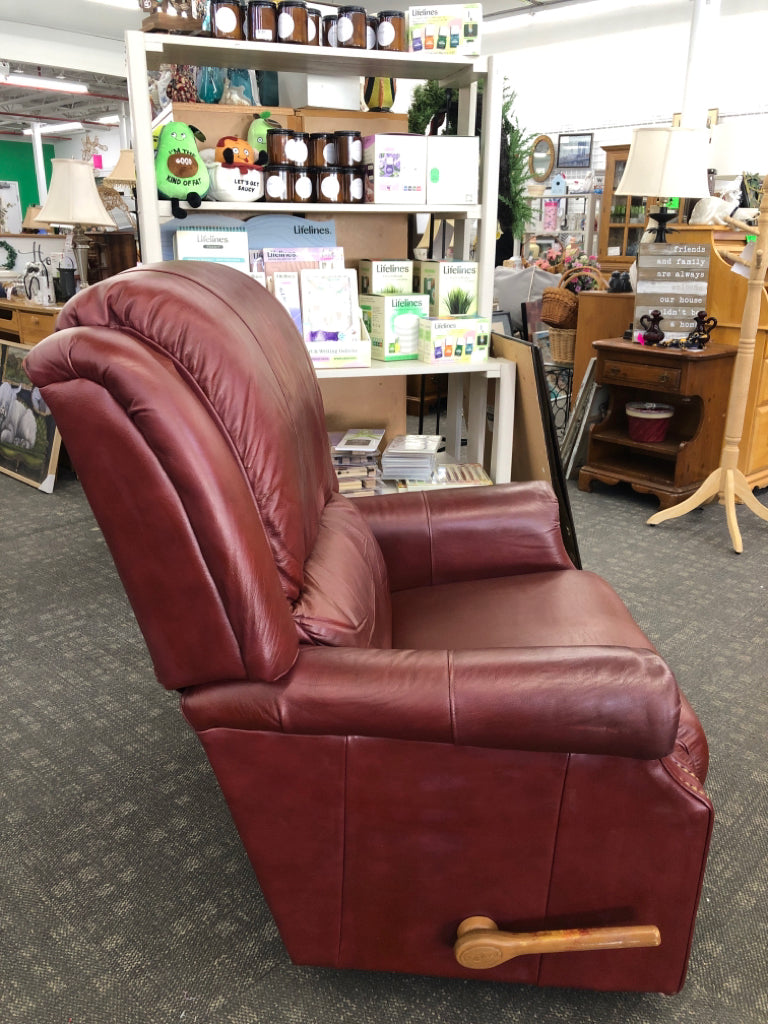 RED LEATHER RECLINER W/GOLD BUTTON DETAILS.
