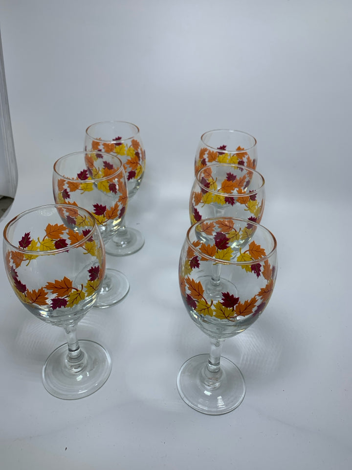 6 CLEAR WINE GLASSES W/ PRINTED FALL LEAVES.