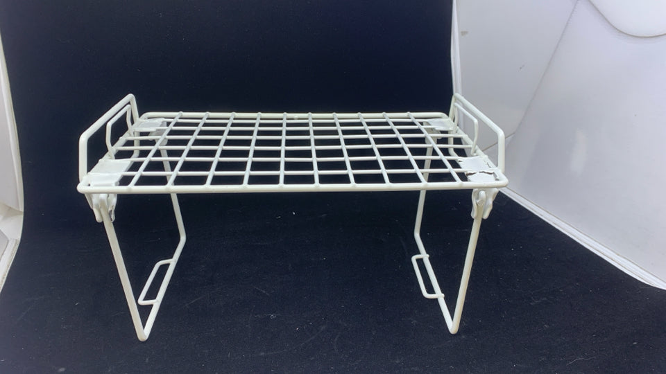 WHITE FOLDING WIRE RACK.