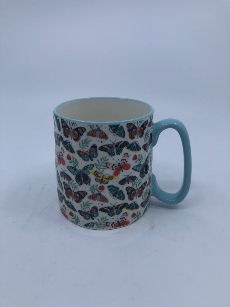 LIGHT BLUE W/ COLORED MOTHS MUG.