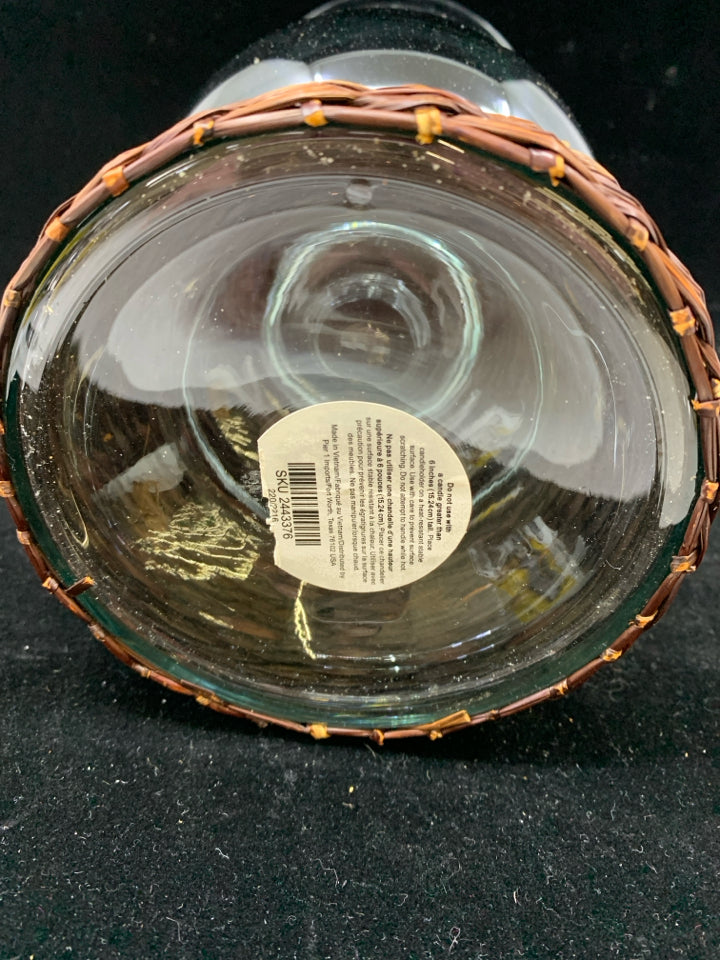 LARGE GLASS CENTERPIECE W/BROWN WICKER BASE.
