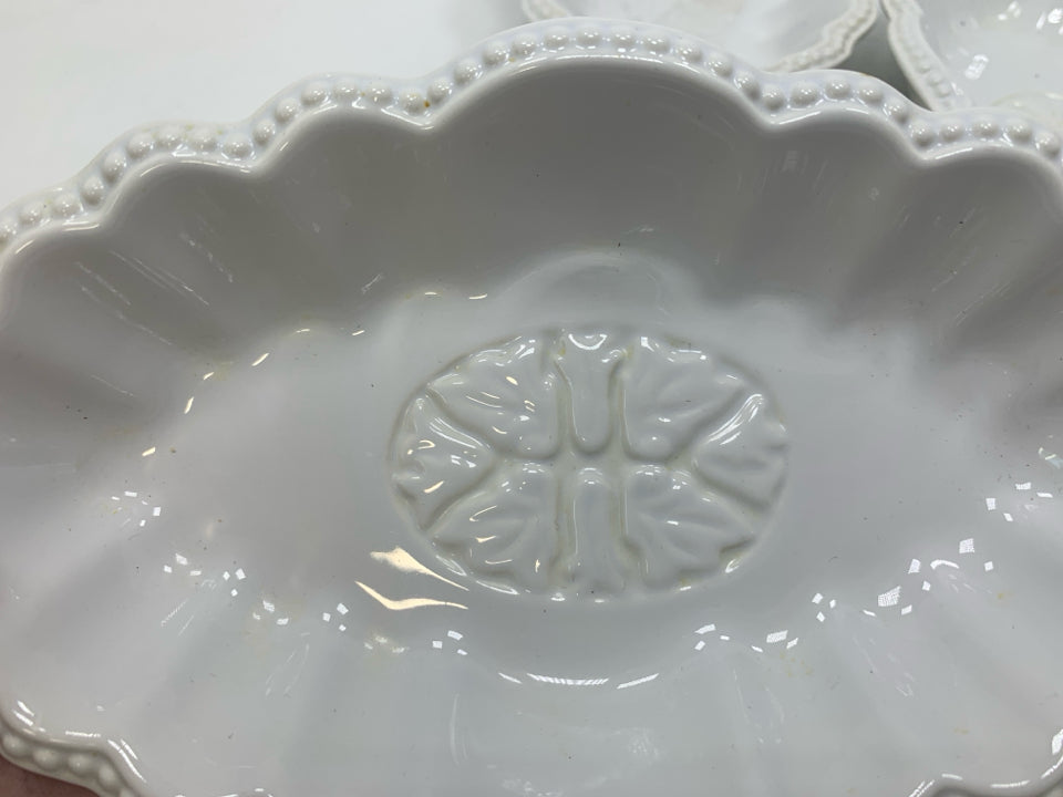 4 OVAL SCALLOP EDGE BOWLS.