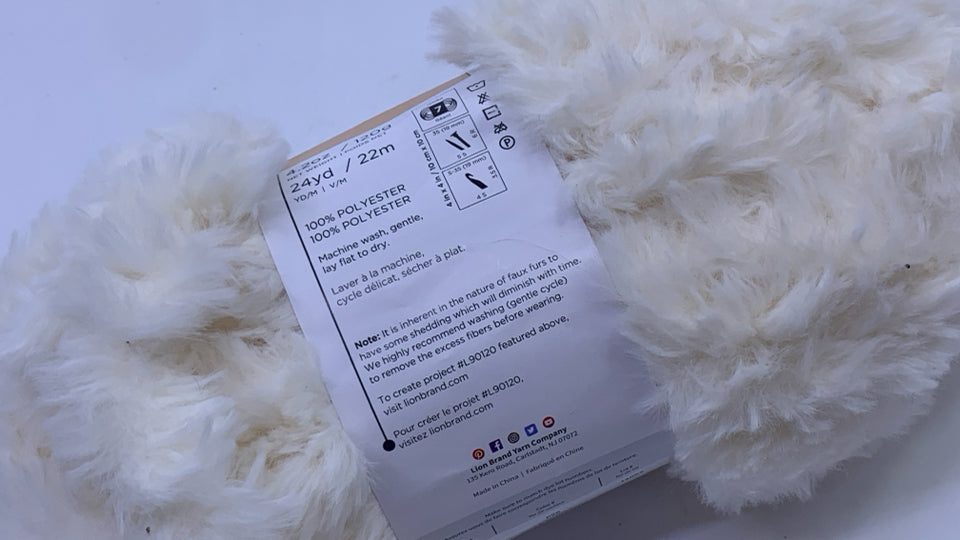 FUZZY CREAM YARN.