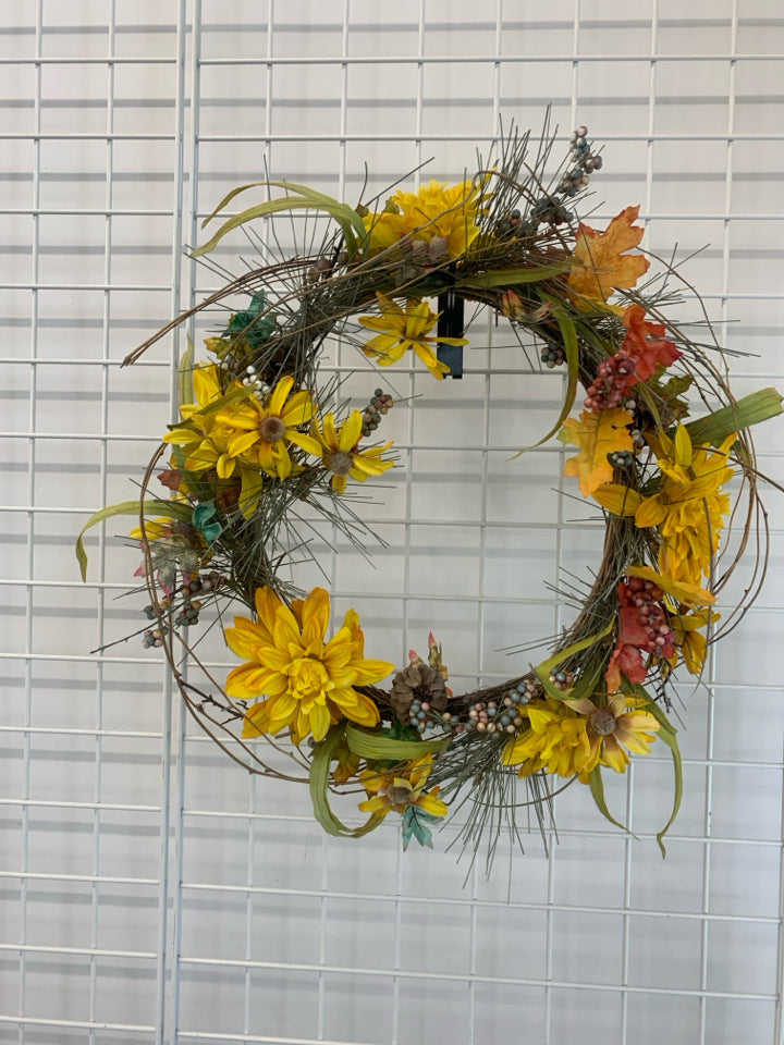 YELLOW FLORAL AND TWIG WREATH.