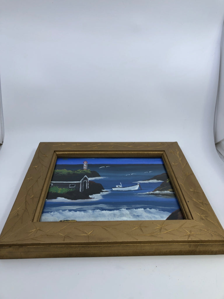 VERY HEAVY GOLD FRAME W/ PAINTED OCEAN THEME.