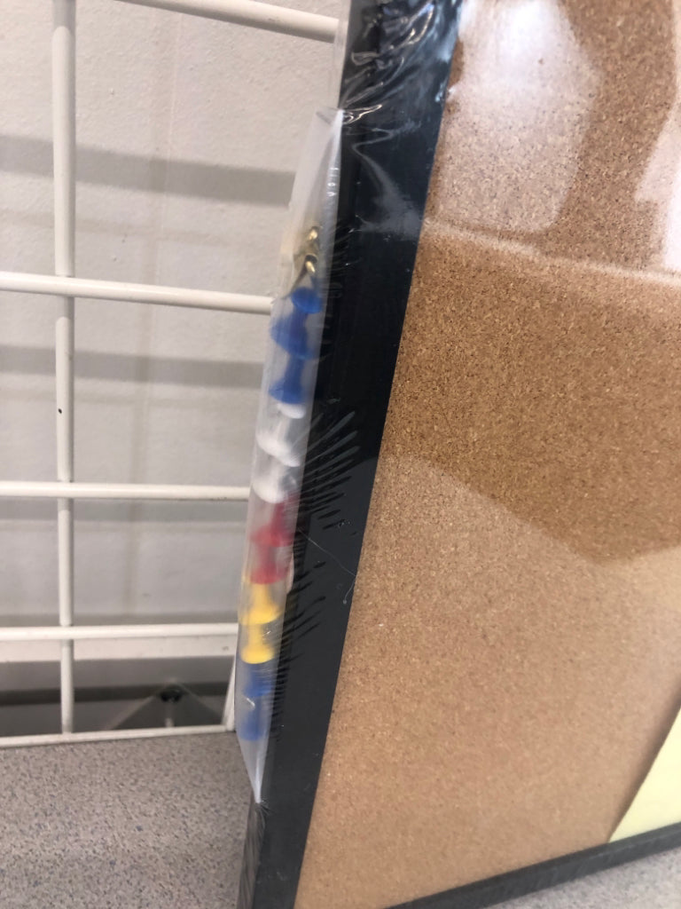 NIP CORK BOARD W/TACKS AND STICKERS.