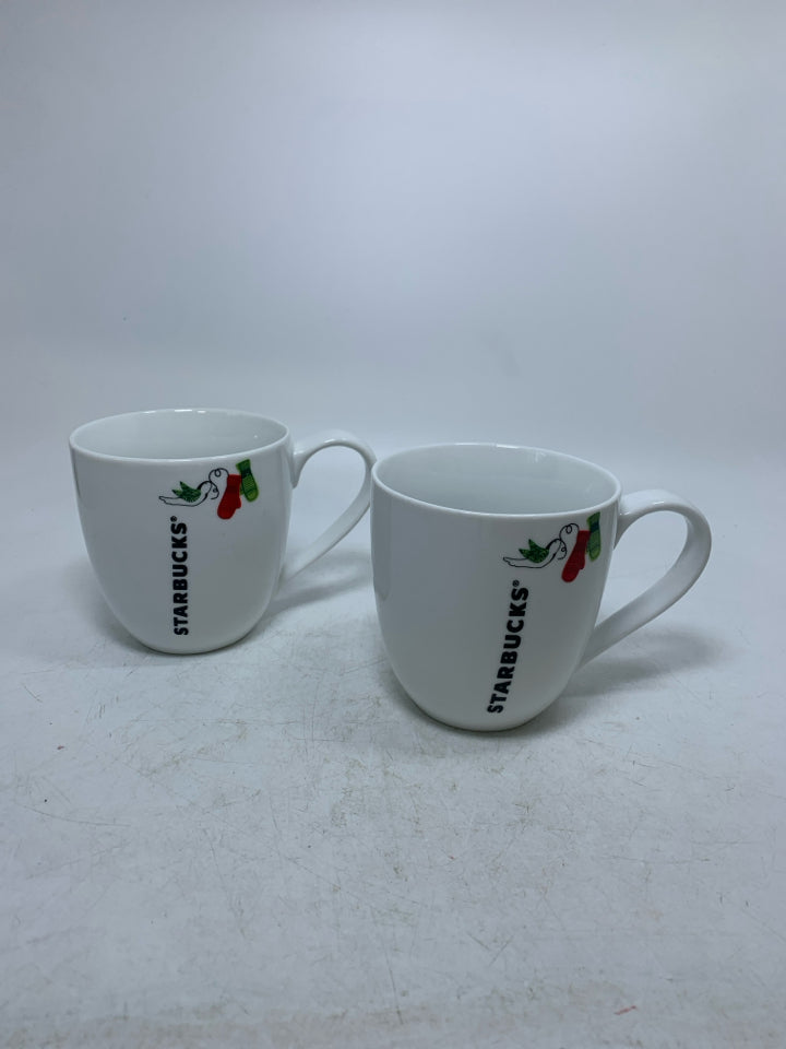 2 WHITE STARBUCKS MUGS W/ MITTENS & DOVE.