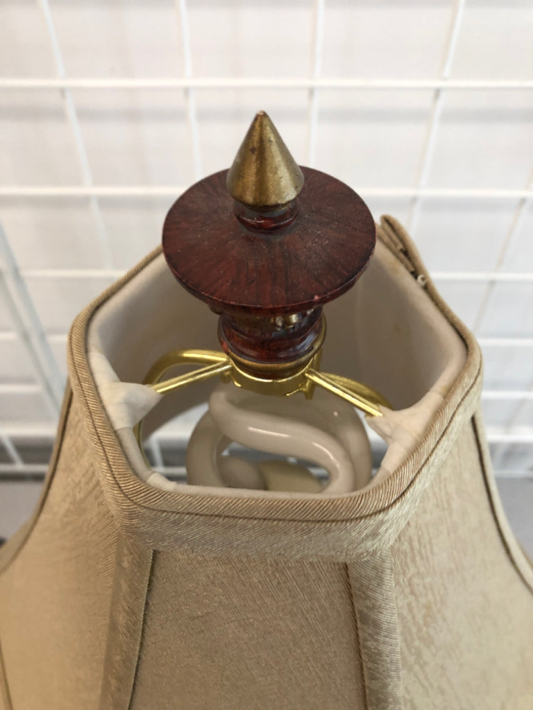 WOOD CAMEL BASE LAMP W/TAN SHADE.