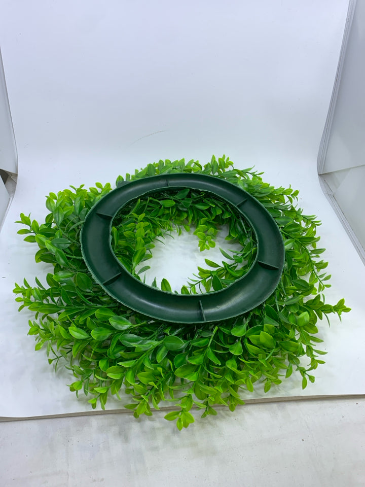 PLASTIC GREENS WREATH.