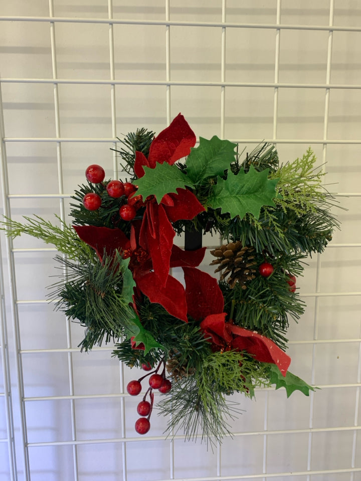 SMALL POINSETTIA W PINECONE WREATH.