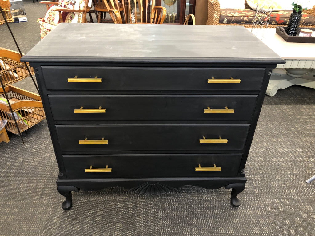 4-DRAWER BLACK DRESSER W/GOLD HANDLES.