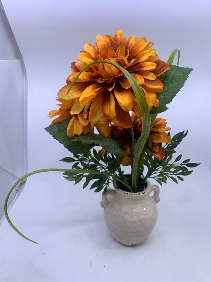 ORANGE FLORAL IN CREAM VASE.