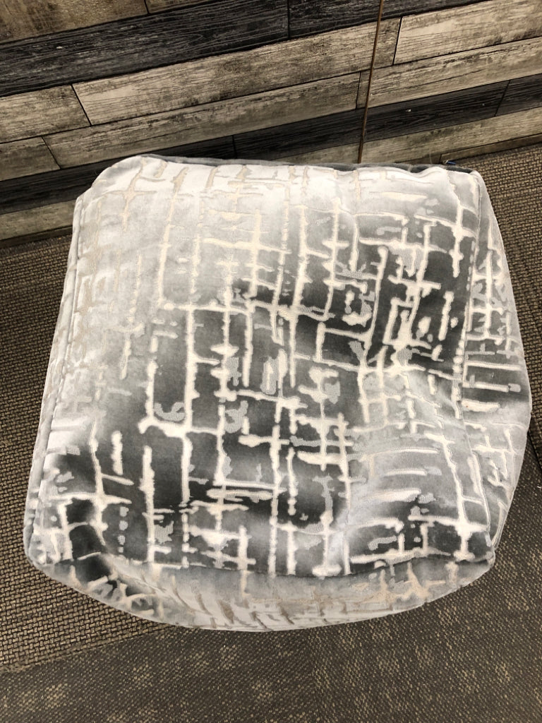 LARGE GREY OTTOMAN CUBE W/CUTOUT DETAILS.