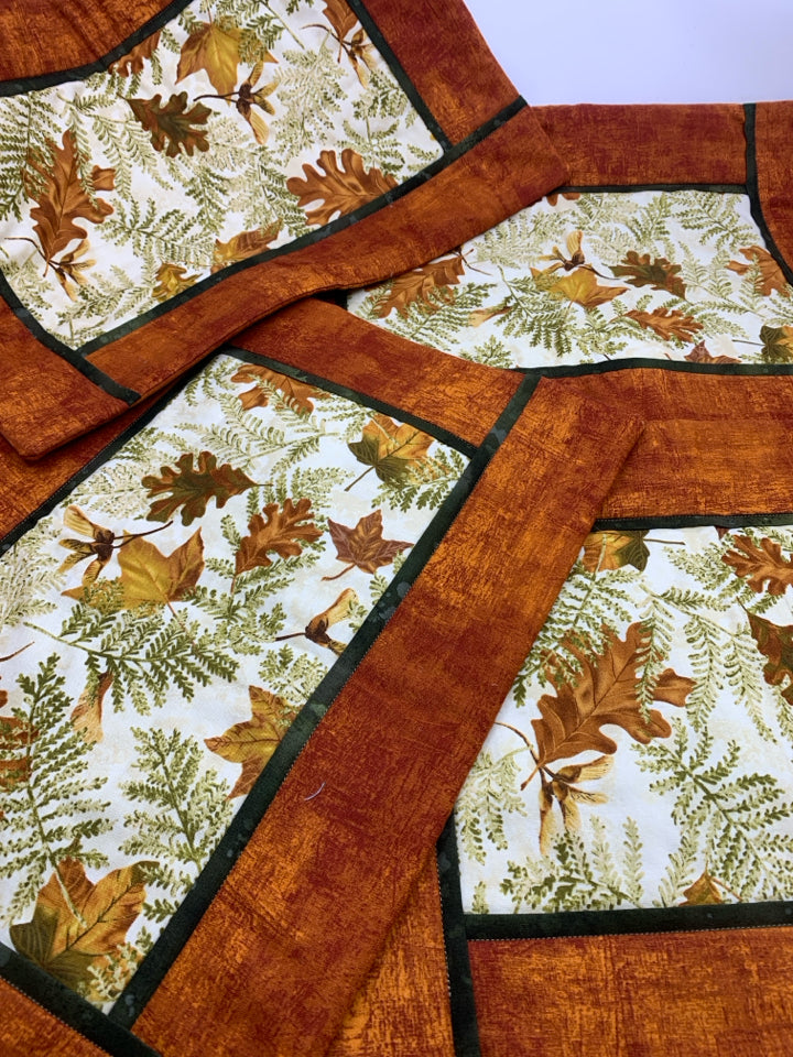 4 ORANGE LEAF PATTERN QUILTED PLACEMATS.