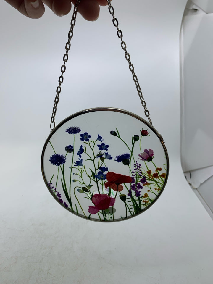 SMALL CIRCLE FROSTED GLASS W/ PRINTED COLORFUL FLOWERS.