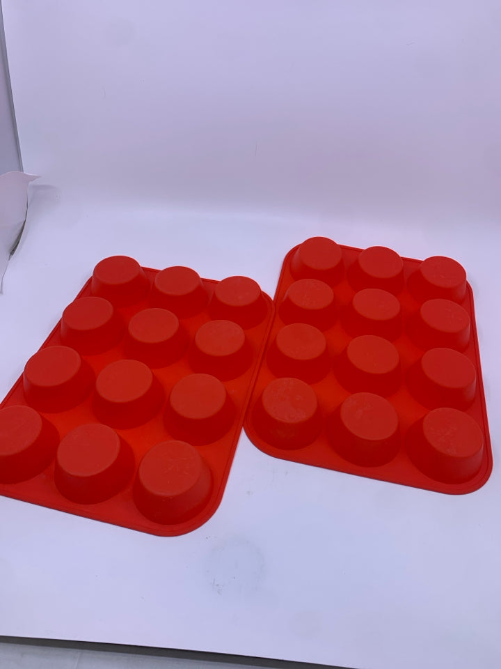 2 RED SILICONE MUFFIN PANS.