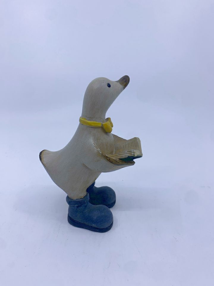 RESIN DUCK READING A BOOK W/ YELLOW BOW TIE.