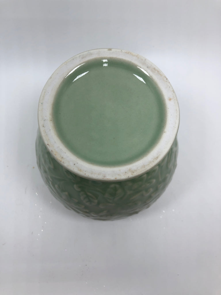 GREEN CERAMIC GINGER JAR W/EMBOSSED FLOWERS.