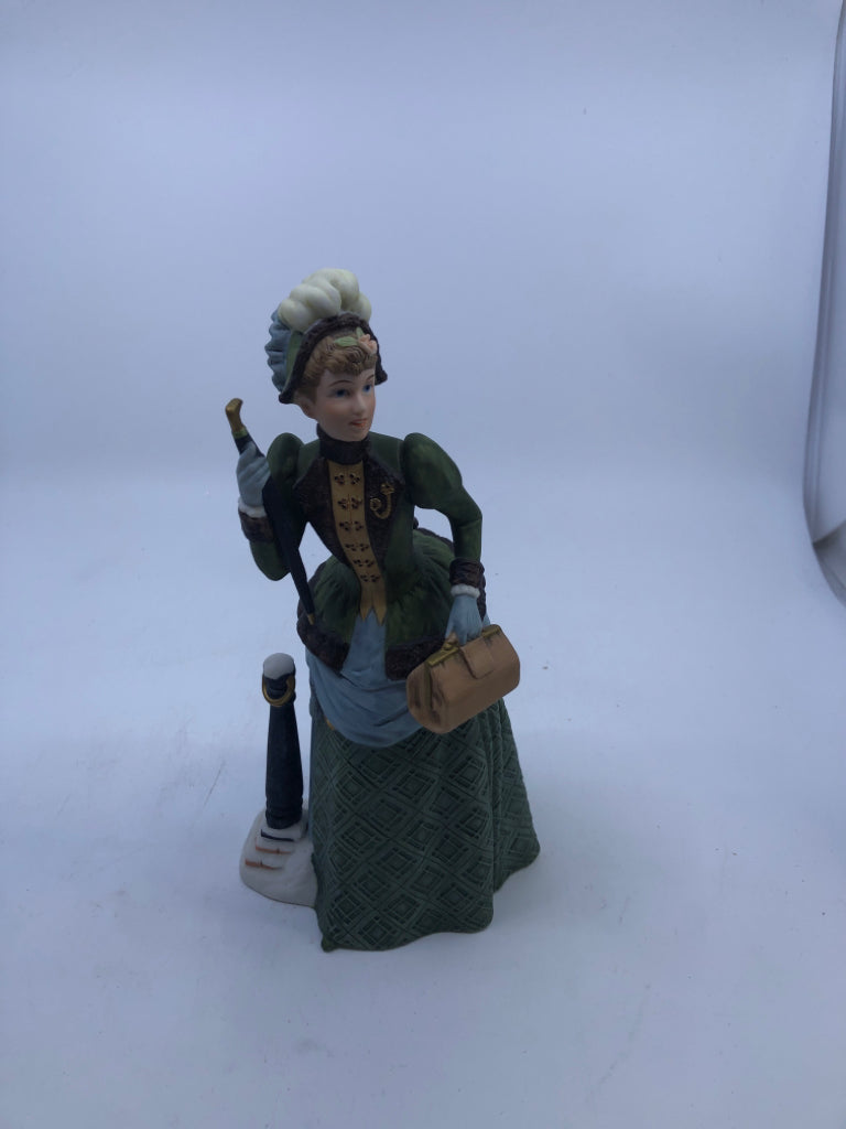 WOMAN IN GREEN DRESS W UMBRELLA- AVON 1987 ALBEE AWARD.
