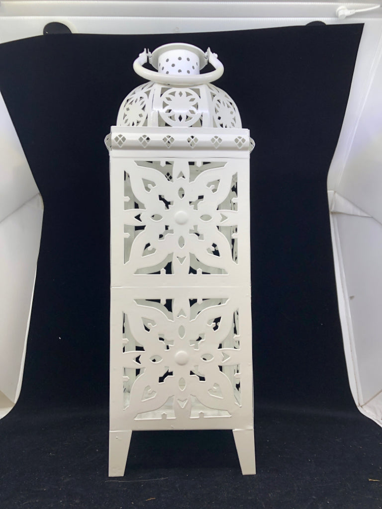 FOOTED WHITE PIERCED METAL LANTERN.
