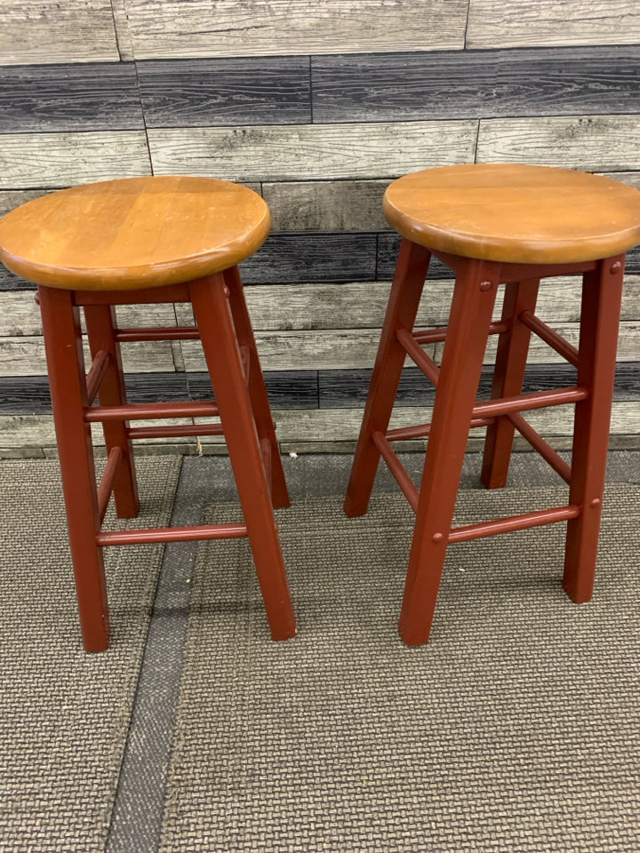 2 WOOD STOOLS MAROON PAINTED LEGS W/ WOOD SEATS.