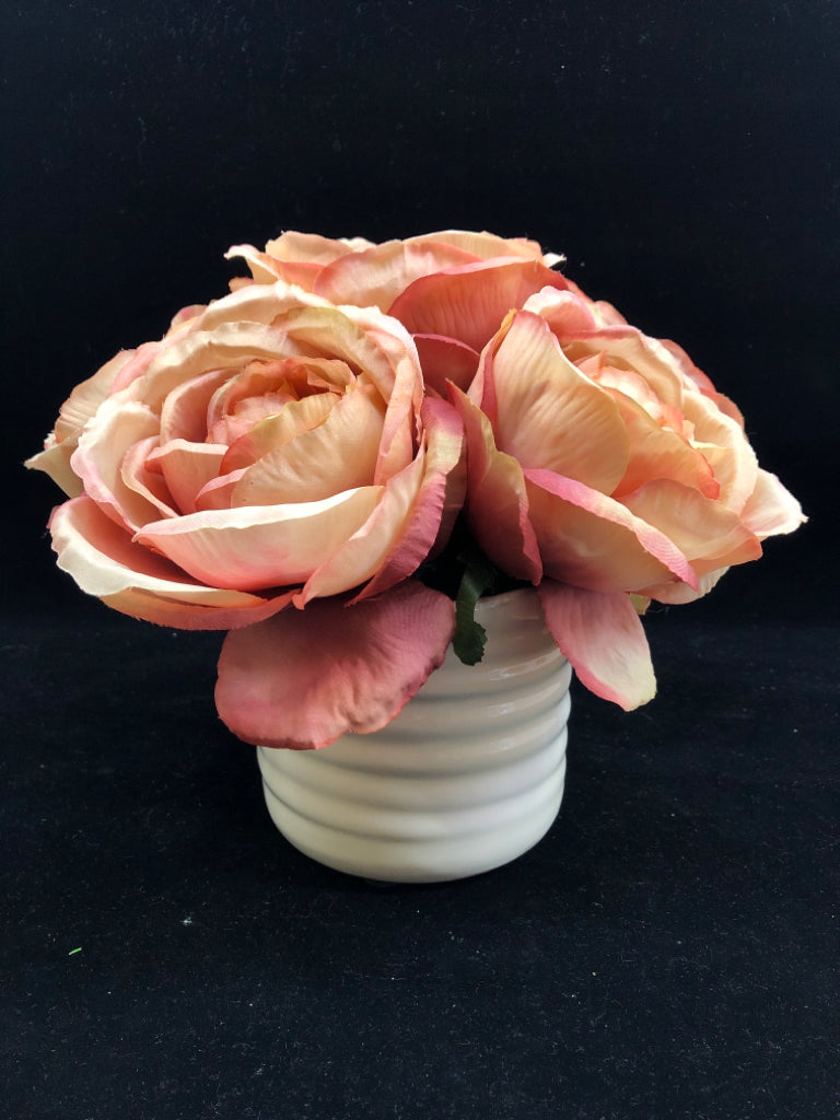 WHITE VASE WITH FAUX PINK ROSES.
