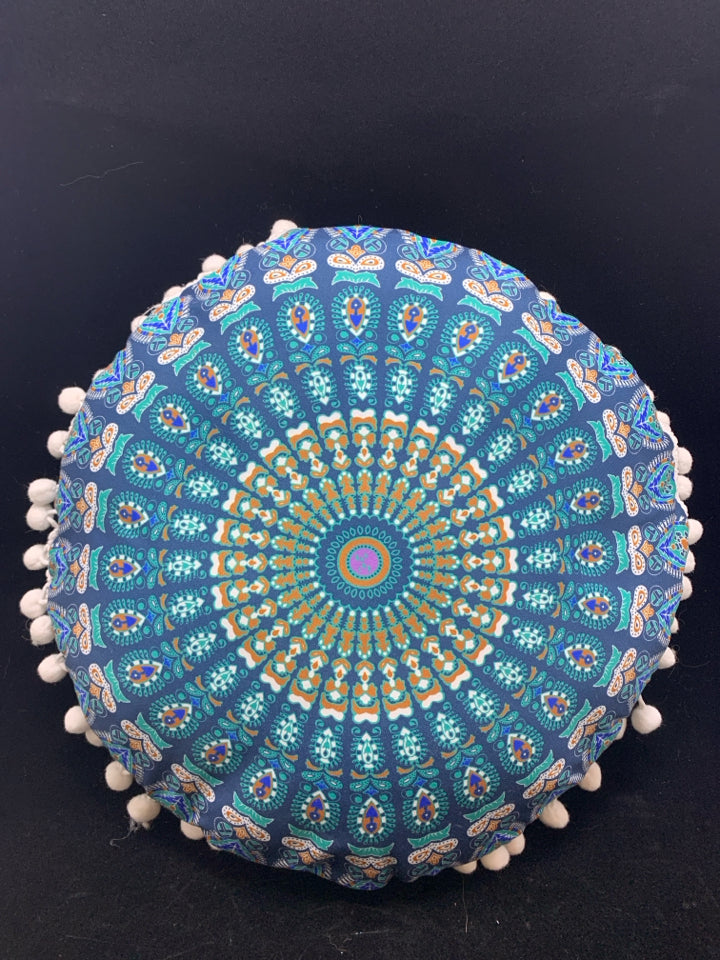 BLUE MEDALLION ACCENT PILLOW W/WHITE POM POMS.