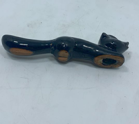 SM CERAMIC BLACK SKUNK FIGURINE.