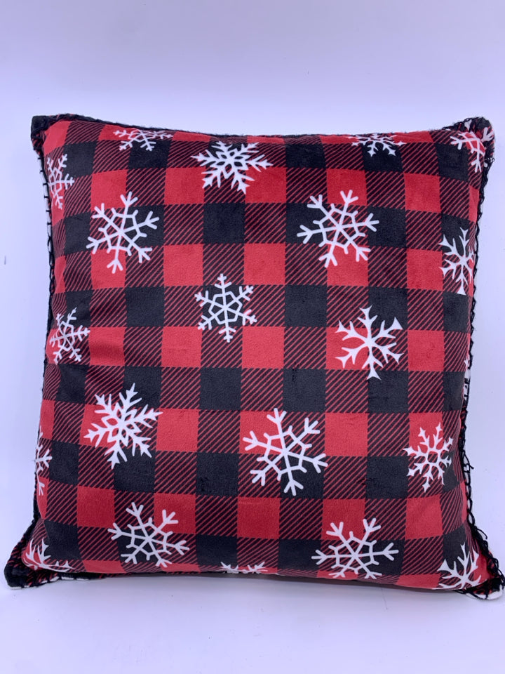 RED BUFFALO PLAID ACCENT PILLOW WITH SNOWFLAKES.