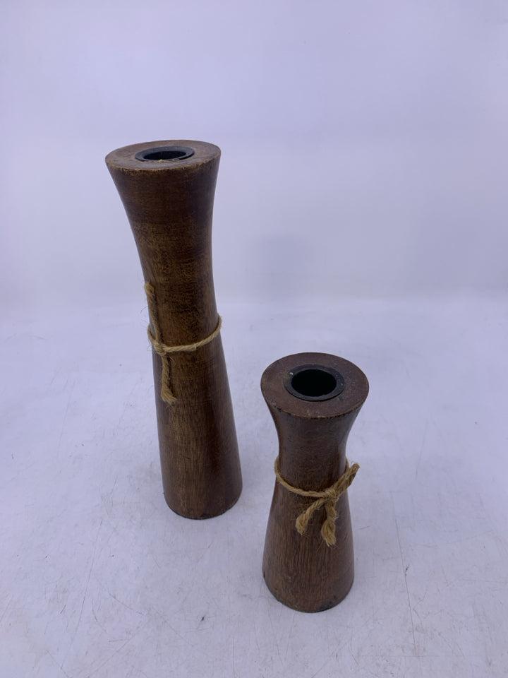 2 DARK WOOD TAPERED CANDLE HOLDERS.