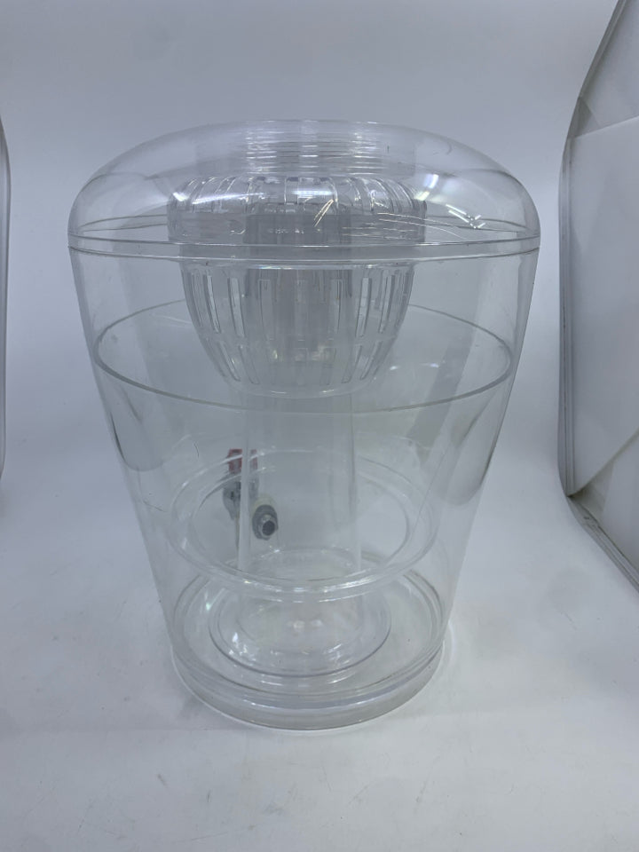 PLASTIC ROUND DRINK DISPENSER W/ ICE HOLDER.