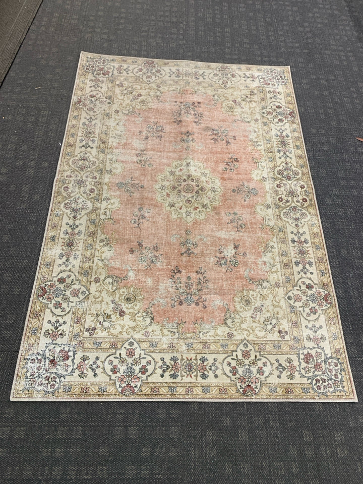 PINK FLORAL RUG.