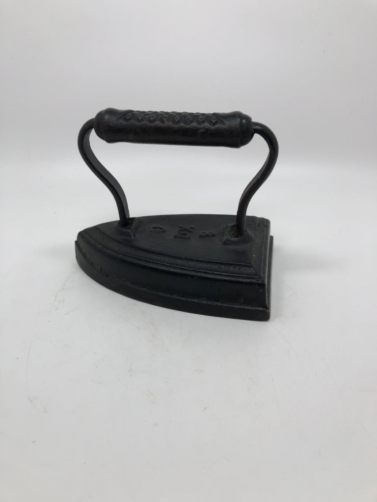 VTG SAD IRON METAL DOOR STOPPER.