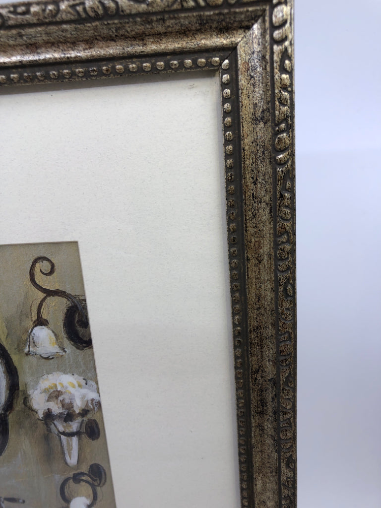 BATHROOM SINK W ORNATE SILVER FRAME.