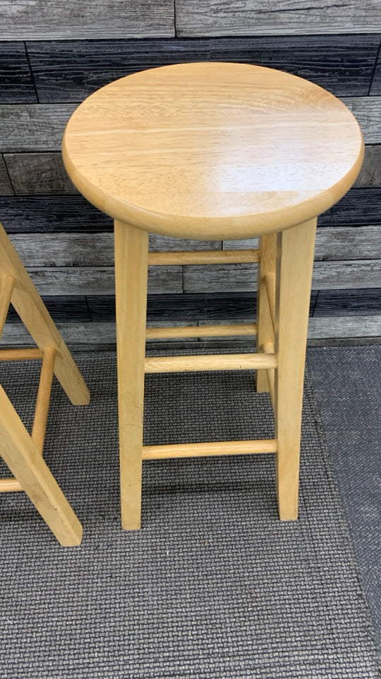 2 BLONDE WOOD STOOLS.