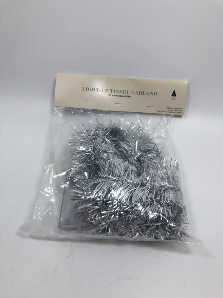 NIP SILVER TINSEL GARLAND W/ LED LIGHTS.