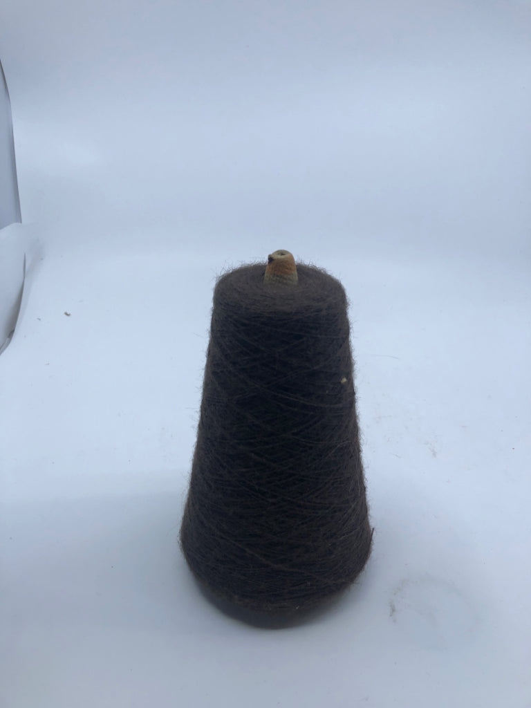 BROWN THREAD ON A SPOOL.